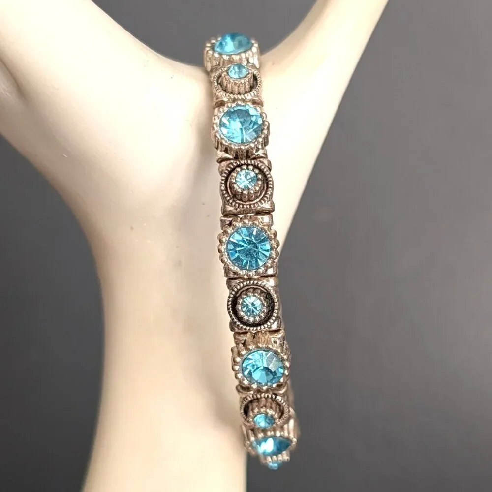 Silver stretch bracelet with blue faceted glass beads
